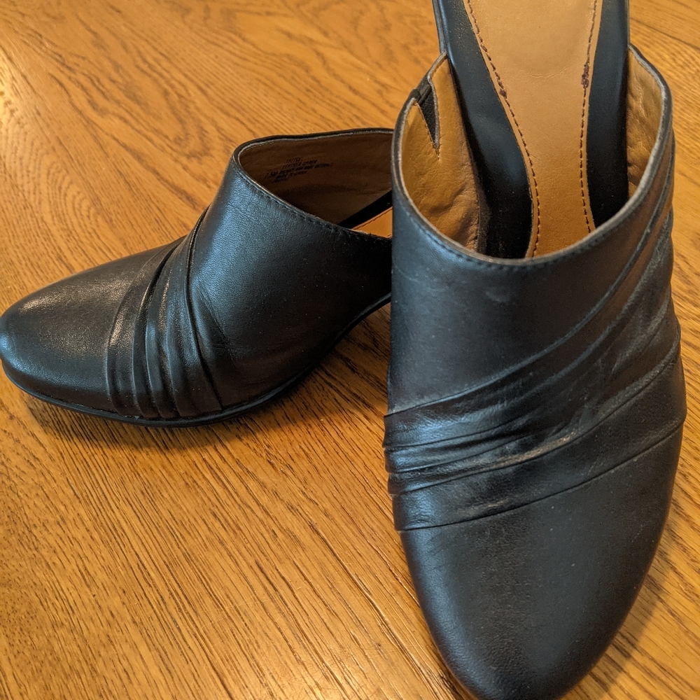 Black leather upper slip on heal. Size 7.5